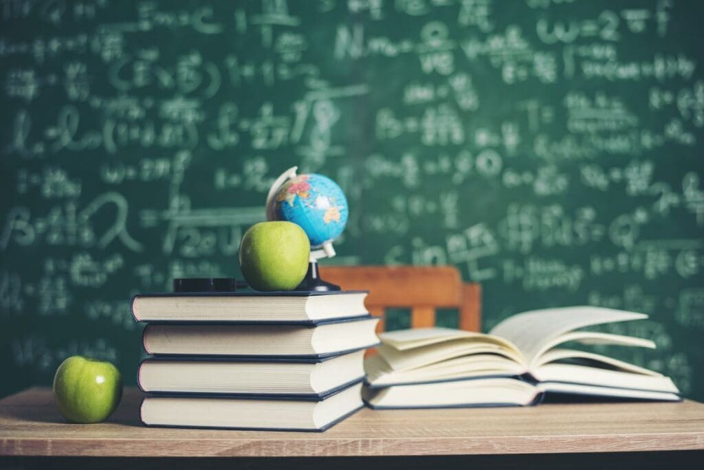 Image: Books with green board background