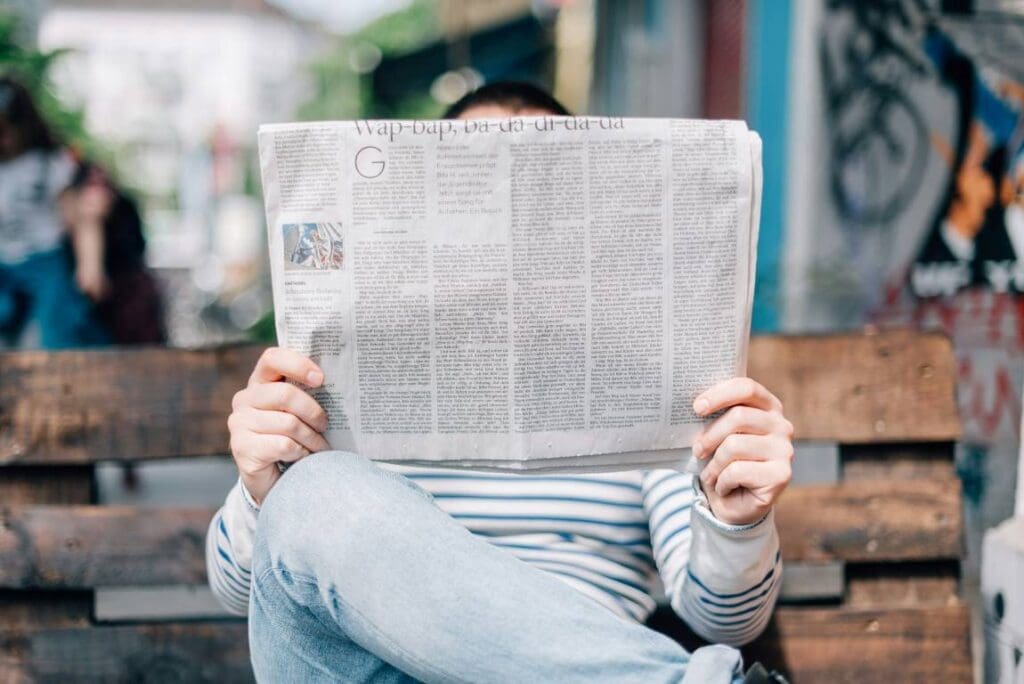 Image: A man reading a newspaper