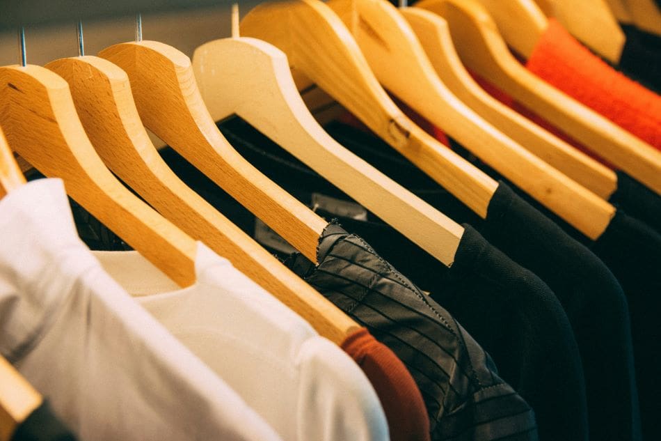 Image: clothes hanged on brown wooden hanger