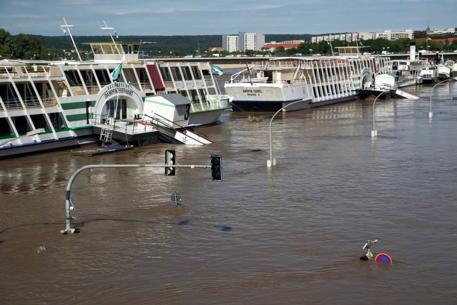 Home Image: Flooded Street with Partially Submerged Boats (s. Germany)