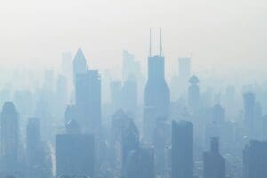 Home Image: aerial view of high-rise buildings covered with smoke (s. air quality, air pollution, China)