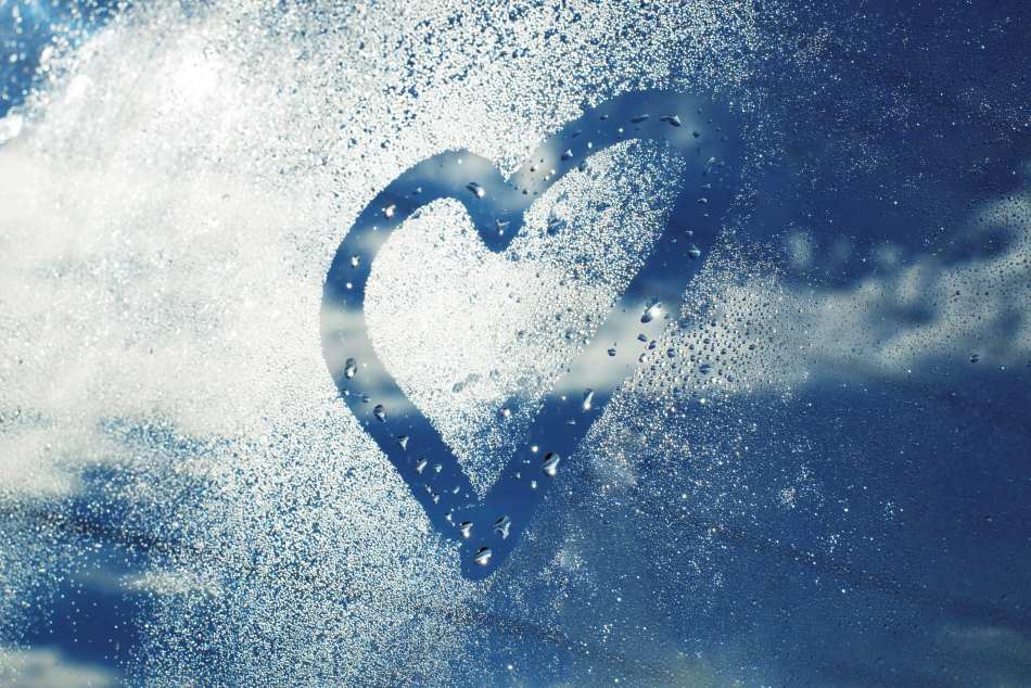 Home Image: Heart shape on cold glass with condensation droplets symbolizing increased cardiovascular risk in cold weather