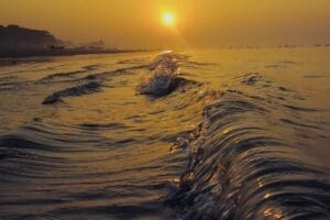 Home Image: seashore, ocean waves at sunset