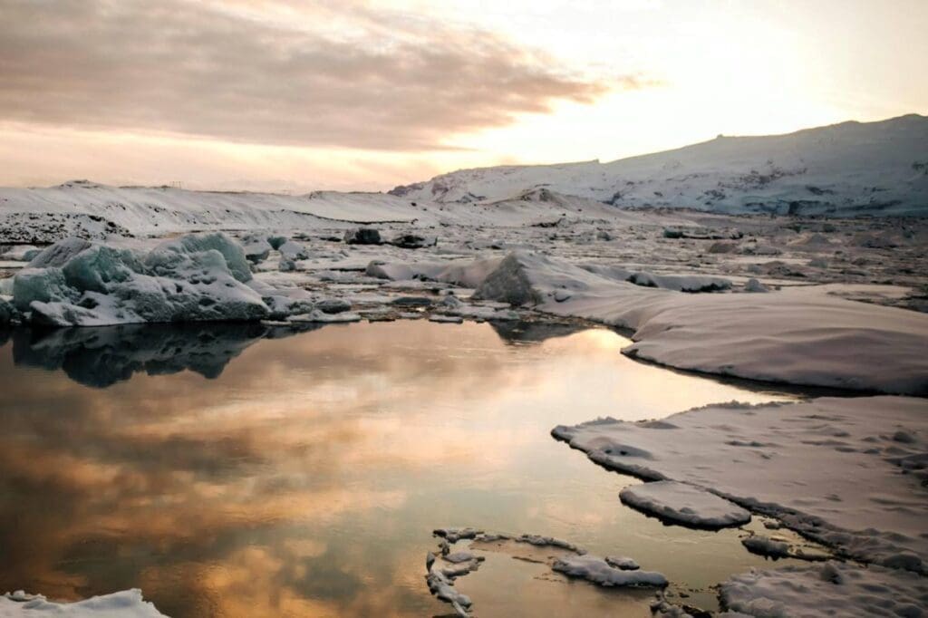 Home Image: Scenic View of a Snow Covered Landscape (s. pond, Arctic, clouds)