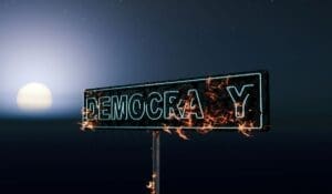 Home Image: a democracy burning neon sign
