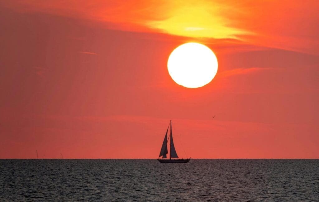 Image: Silhouette of Sailboat on Sea during Sunset
