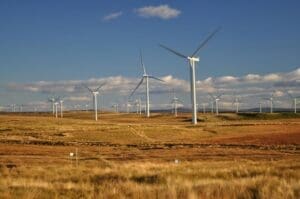 Home Image: White Windmills Under a Blue Sky - Eaglesham, Scotland, United Kingdom (s. clean energy)