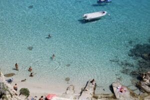 Home Image: a group of people swimming in a body of water