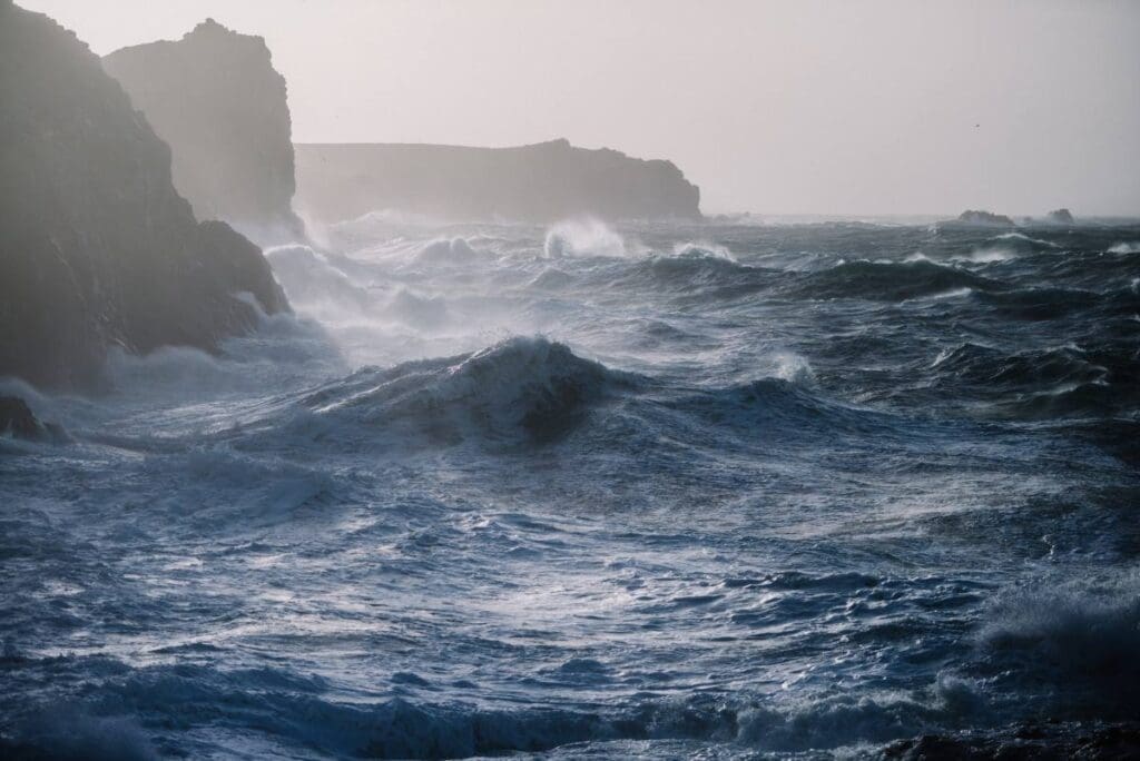 Home Image: sea waves crashing over rock formations (s. storm)