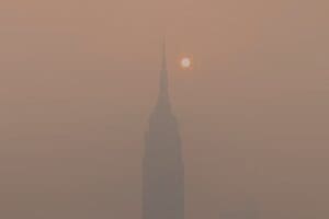 Home Image: a foggy skyline with a tall building in the distance