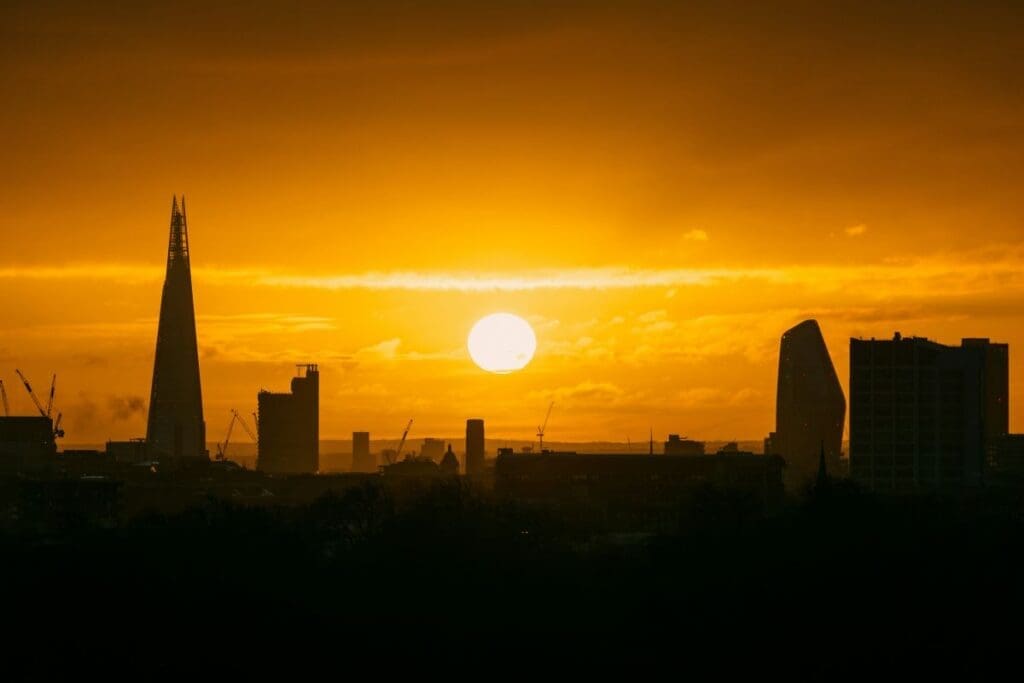 Image: the sun is setting over the city of london