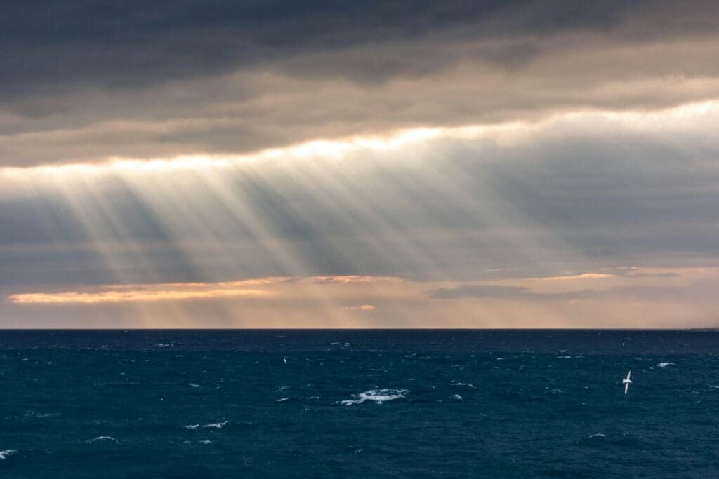 Home Image: sun ray hitting body of water (Atlantic Ocean, Westman Islands, Iceland)