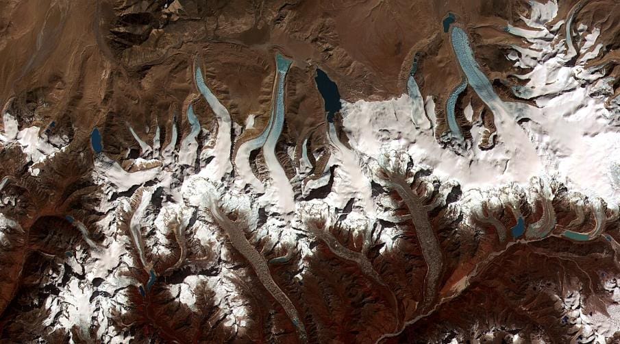 Home Satellite Image: Glacial lakes from retreating glaciers (termini of the glaciers in the Bhutan-Himalaya. Image provided by Jeffrey Kargel, USGS/NASA JPL/AGU)