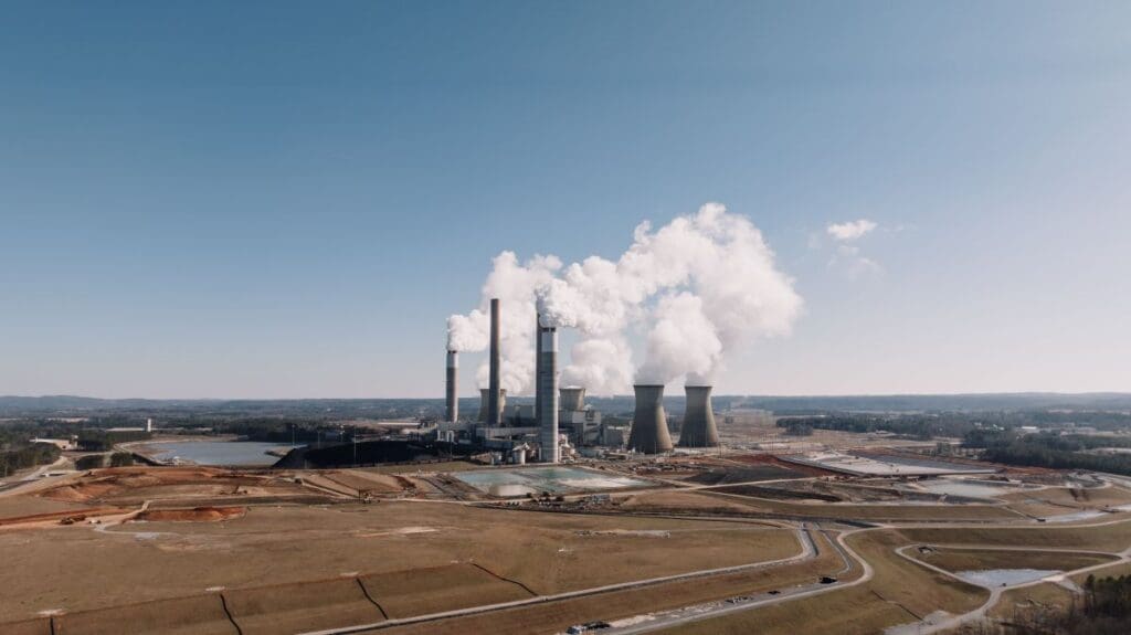 Image: Aerial view of power plant with smoke emissions in Euharlee, GA under a clear sky | Euharlee, GA, United States