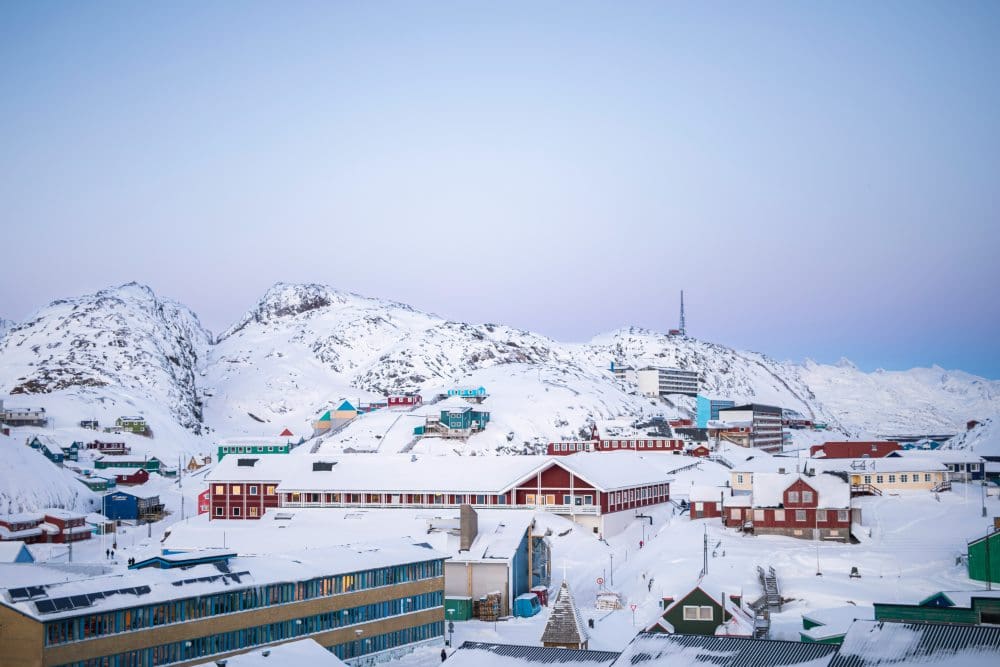 Image: Snow-covered houses in Maniitsoq, southwestern Greenland